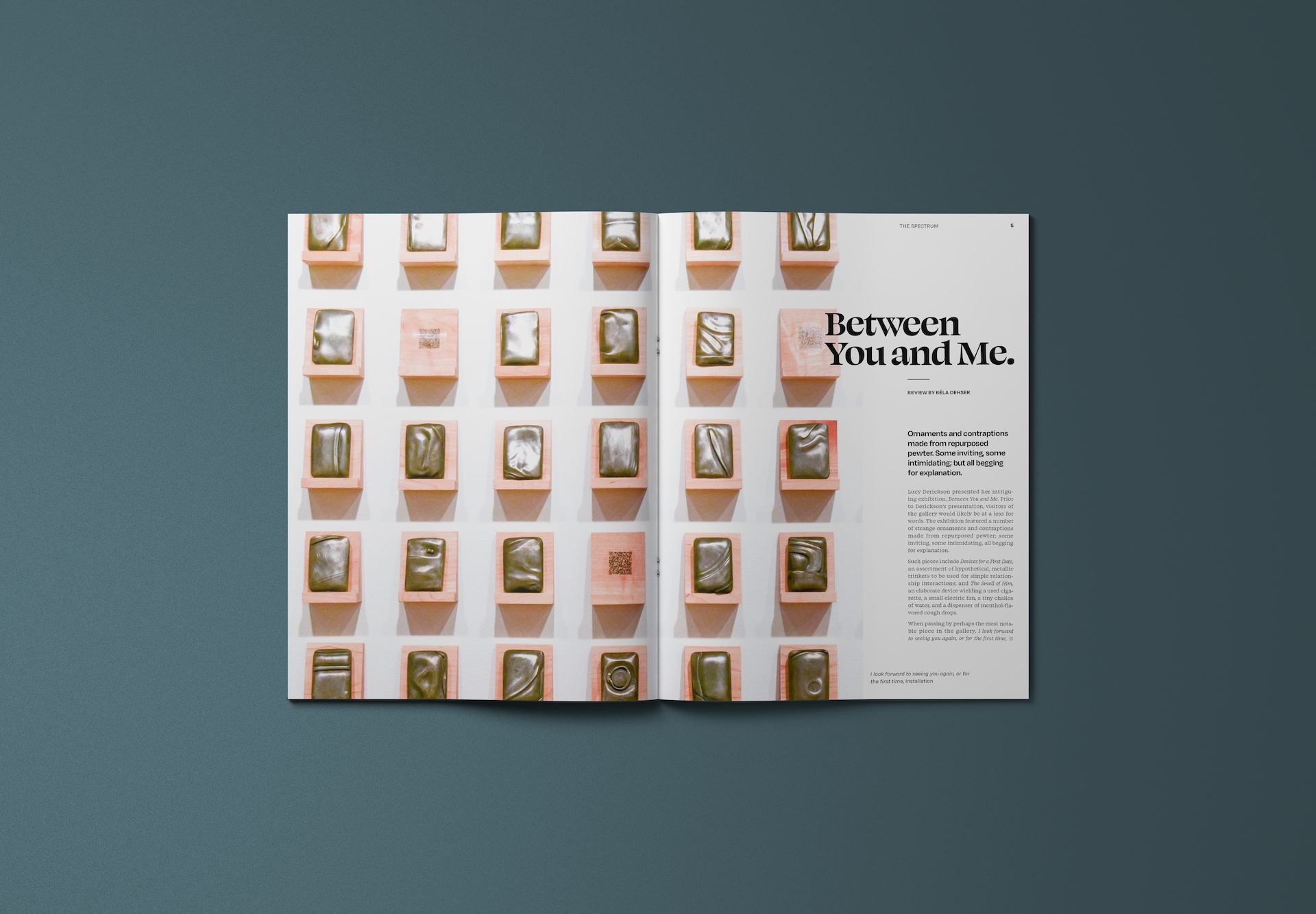 A featured article titled 'Between You and Me' spans a magazine spread. A large picture of rectangular metal relics takes up an entire page, and then some.